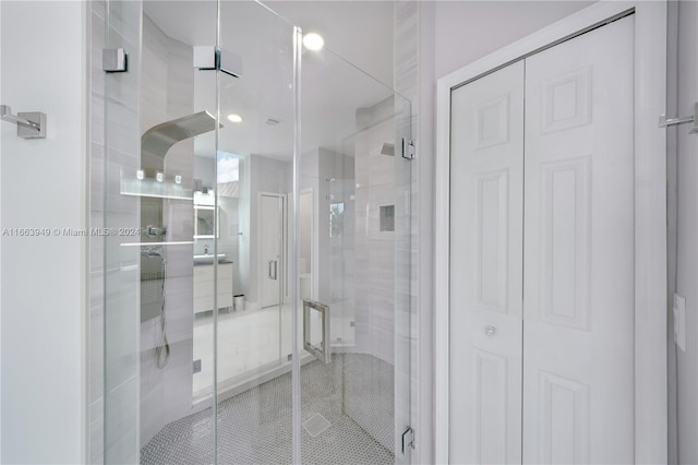 bathroom with a shower with shower door