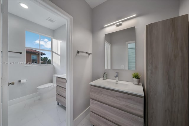 bathroom with vanity and toilet