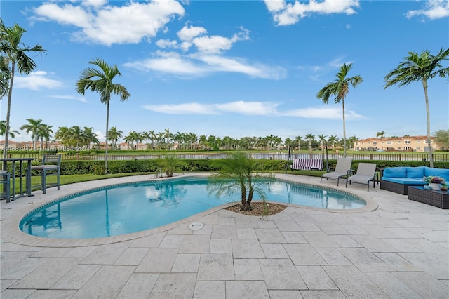 view of pool featuring an outdoor living space and a patio area