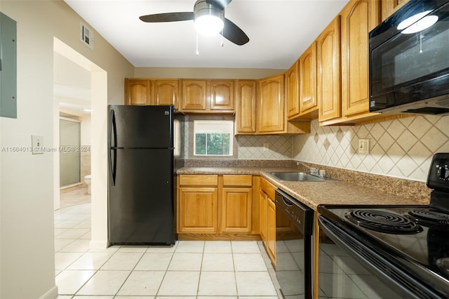 kitchen with decorative backsplash, light tile patterned floors, black appliances, ceiling fan, and sink