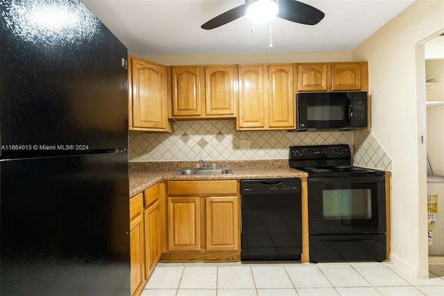 kitchen featuring light tile patterned flooring, backsplash, black appliances, ceiling fan, and sink