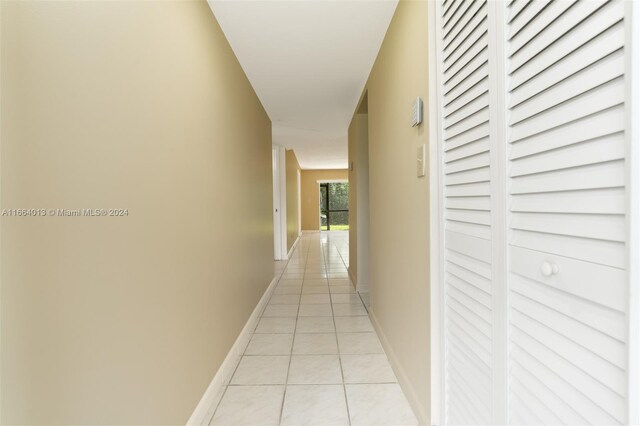 hallway featuring light tile patterned flooring