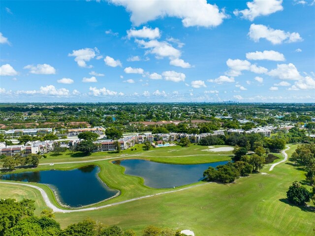 bird's eye view featuring view of golf course and a water view