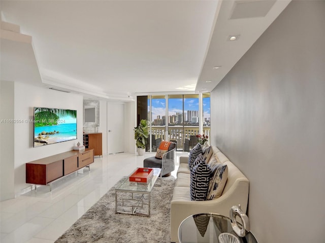 tiled living room with a wall of windows