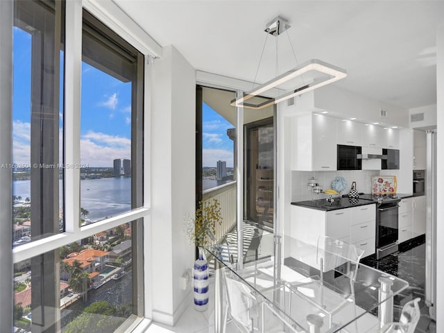 dining room with a water view