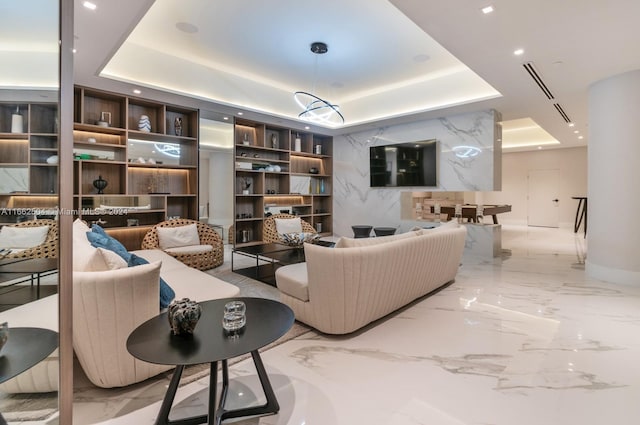 living room featuring a tray ceiling