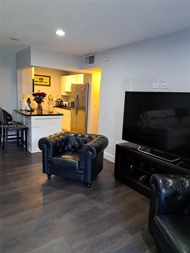 living room with dark hardwood / wood-style floors