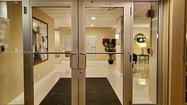 workout area featuring a paneled ceiling