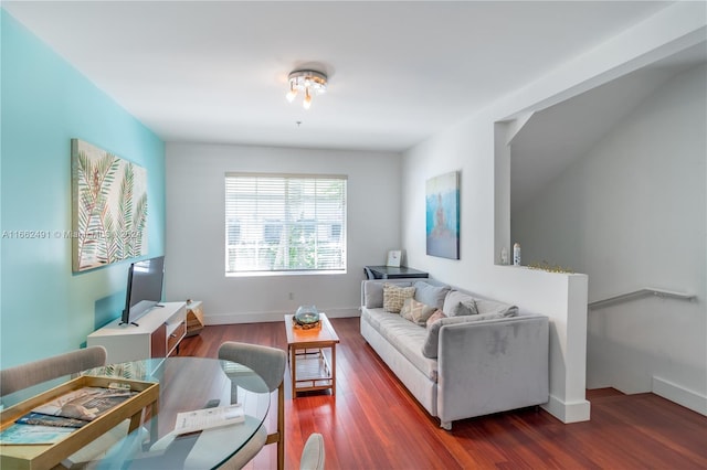 living room featuring dark wood-type flooring