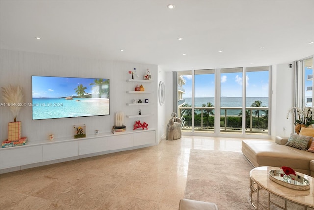 unfurnished living room featuring a wall of windows and a healthy amount of sunlight