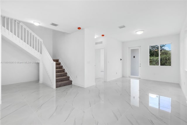 22425 SW 125th Ave Unit 22425, Miami, FL 33170 - unfurnished living room featuring marble finish floor, visible vents, and stairway