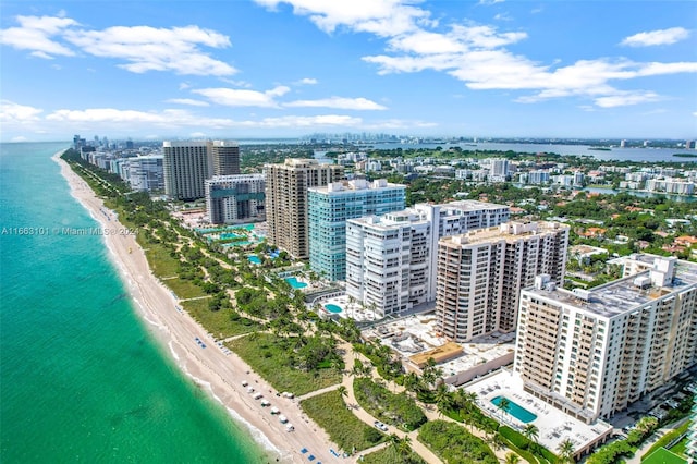 bird's eye view with a view of the beach and a water view