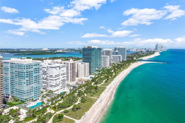 drone / aerial view featuring a view of the beach and a water view