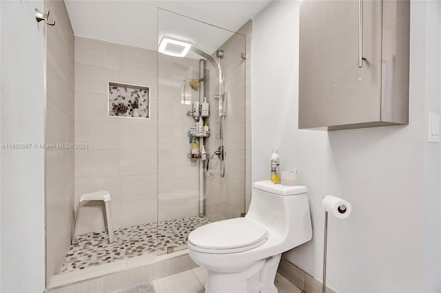 bathroom with an enclosed shower and toilet