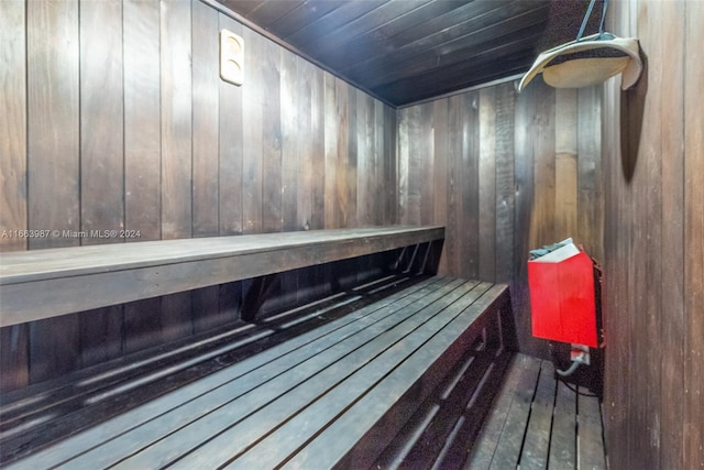 view of sauna / steam room featuring wood walls and hardwood / wood-style floors