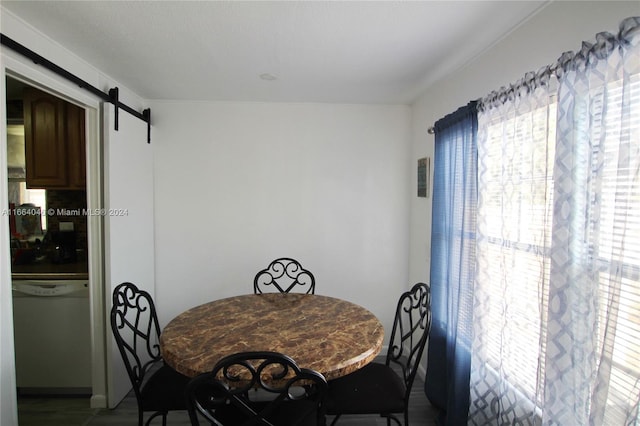 dining space with a barn door