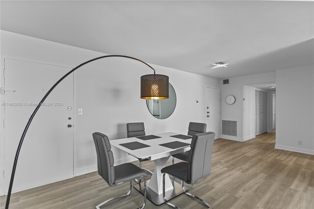 dining area with light wood-type flooring