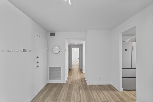 unfurnished room featuring light hardwood / wood-style floors