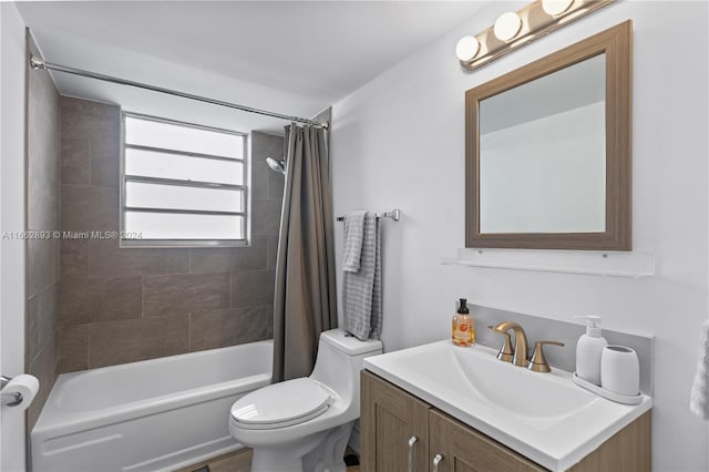 full bathroom featuring vanity, shower / tub combo, and toilet