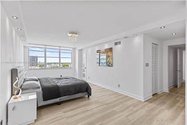 bedroom with light hardwood / wood-style floors