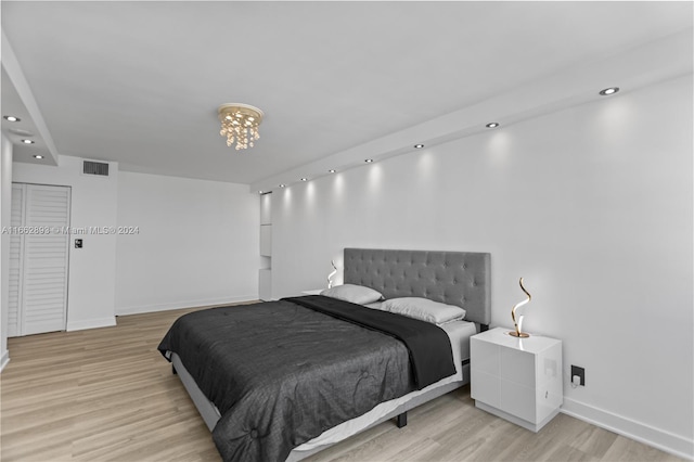 bedroom with light wood-type flooring