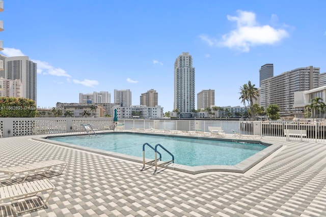 view of swimming pool featuring a patio area