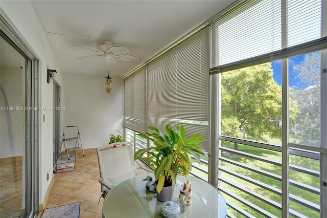 sunroom / solarium featuring a wealth of natural light and ceiling fan