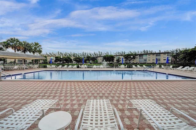 view of swimming pool featuring a patio area