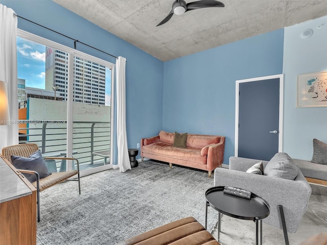 carpeted living room with ceiling fan