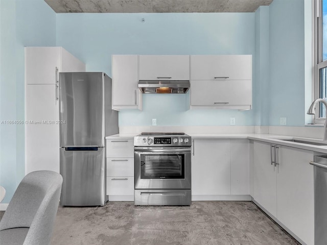 kitchen with stainless steel appliances, sink, and white cabinetry