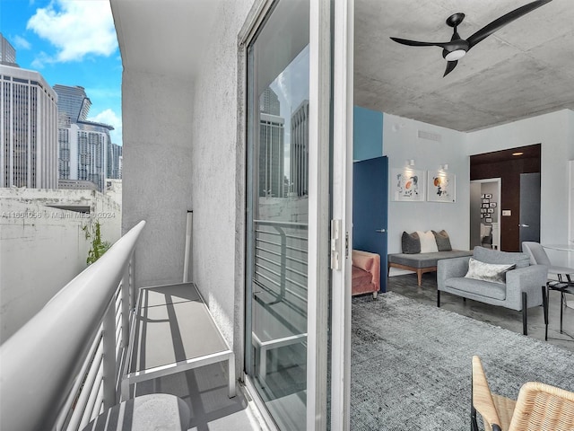 balcony with an outdoor hangout area and ceiling fan