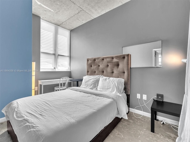 bedroom with concrete flooring