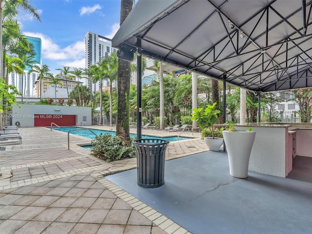 view of swimming pool featuring a patio