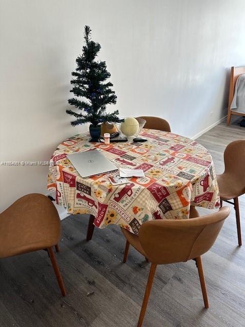 dining room with hardwood / wood-style flooring