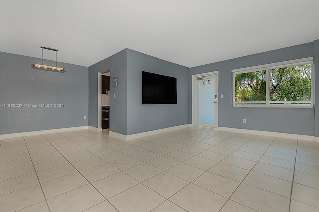 empty room with light tile patterned floors