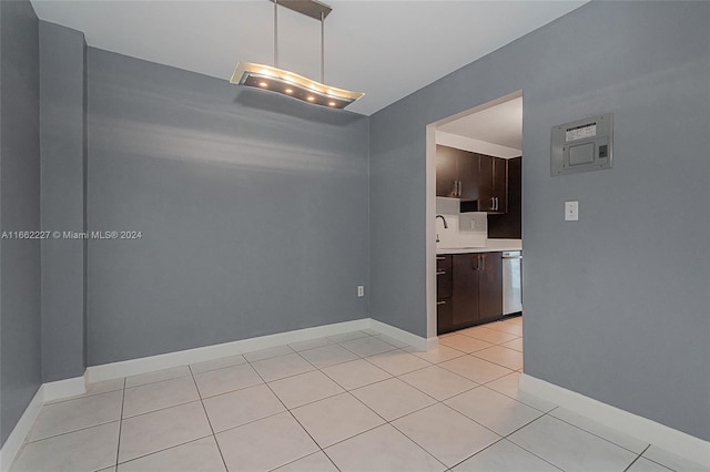 tiled empty room featuring sink