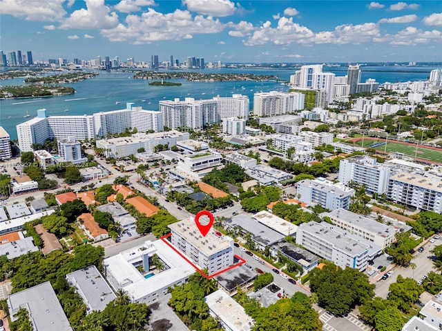 birds eye view of property featuring a water view