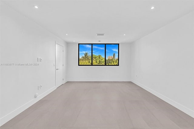 unfurnished room featuring light hardwood / wood-style floors