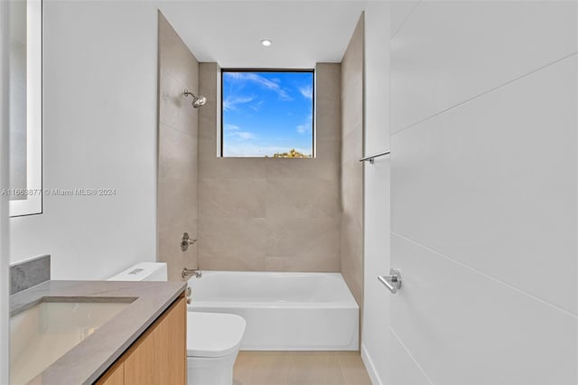 full bathroom with vanity, toilet, tile patterned floors, and tiled shower / bath