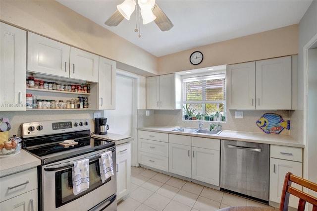 kitchen with white cabinets, ceiling fan, appliances with stainless steel finishes, and sink