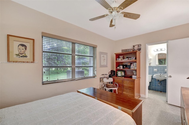 bedroom with ceiling fan and connected bathroom