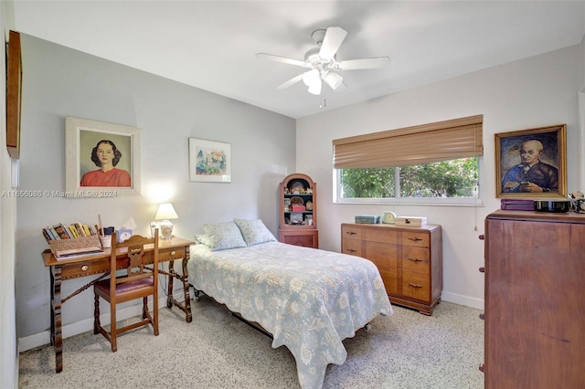 bedroom with light carpet and ceiling fan