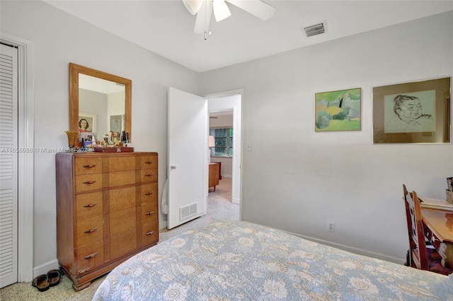 bedroom featuring light carpet and ceiling fan