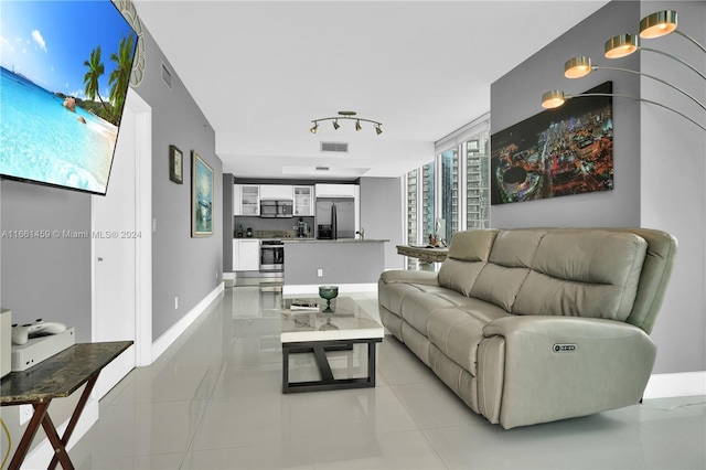 living room featuring light tile patterned flooring