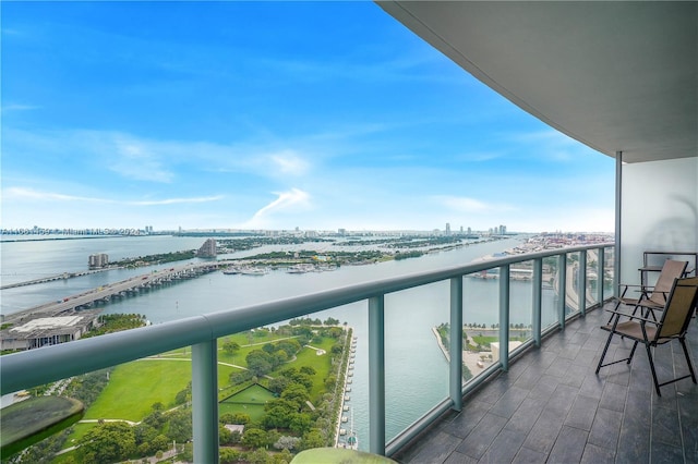 balcony featuring a water view