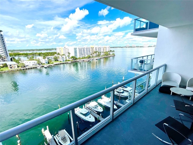 balcony featuring a water view