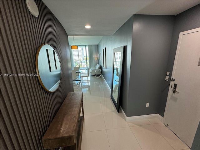 corridor with light tile patterned flooring