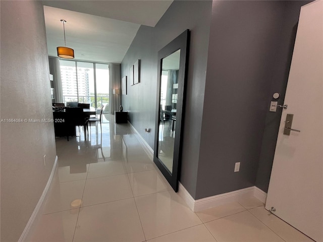 corridor with light tile patterned floors