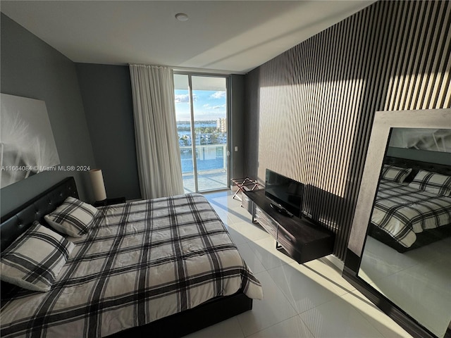 tiled bedroom with access to outside and expansive windows