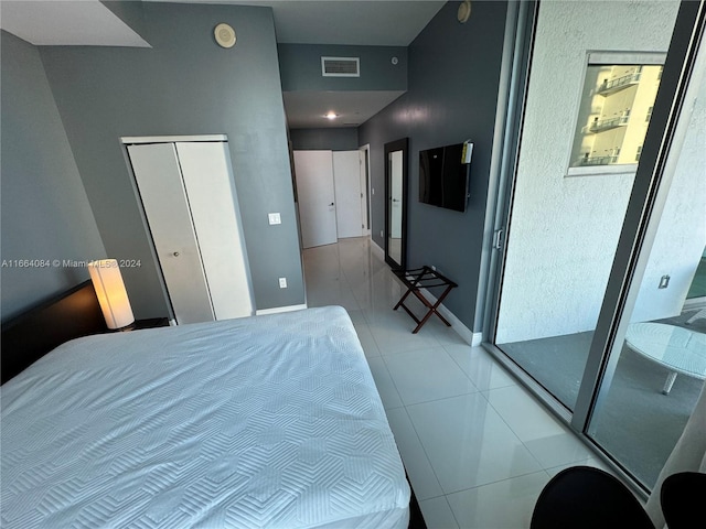 bedroom with light tile patterned floors